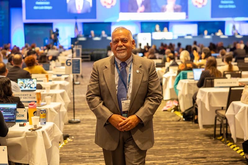 A man standing in front of a room full of people