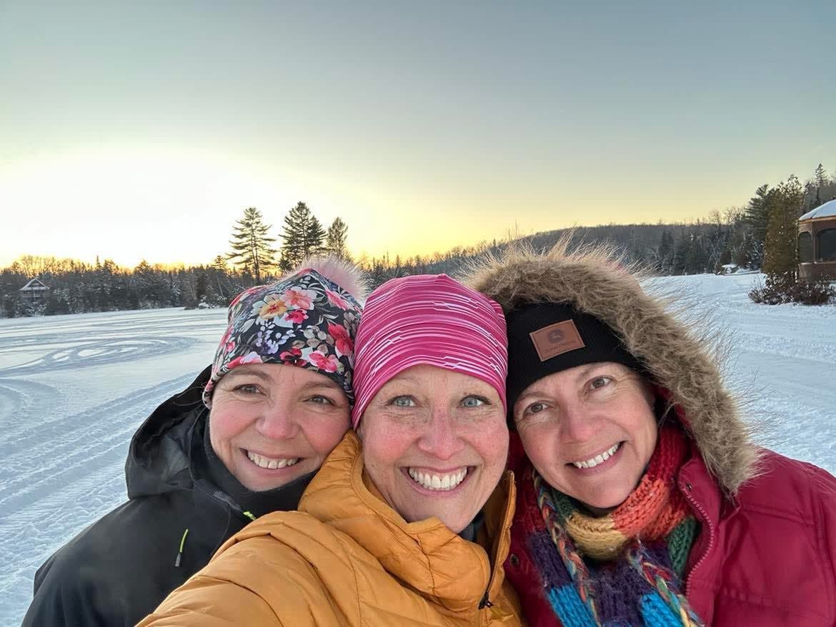 Three women taking a selfie in the snow