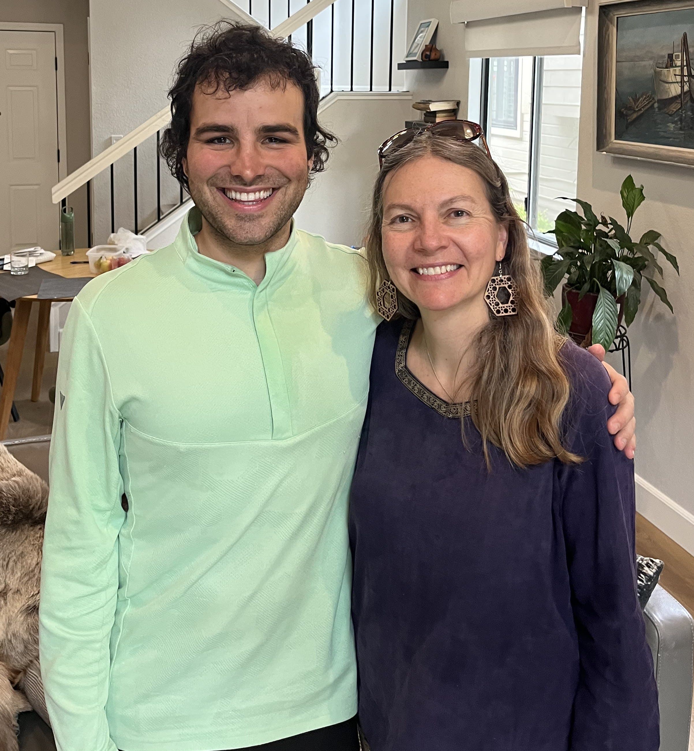 A man standing next to a woman in a living room