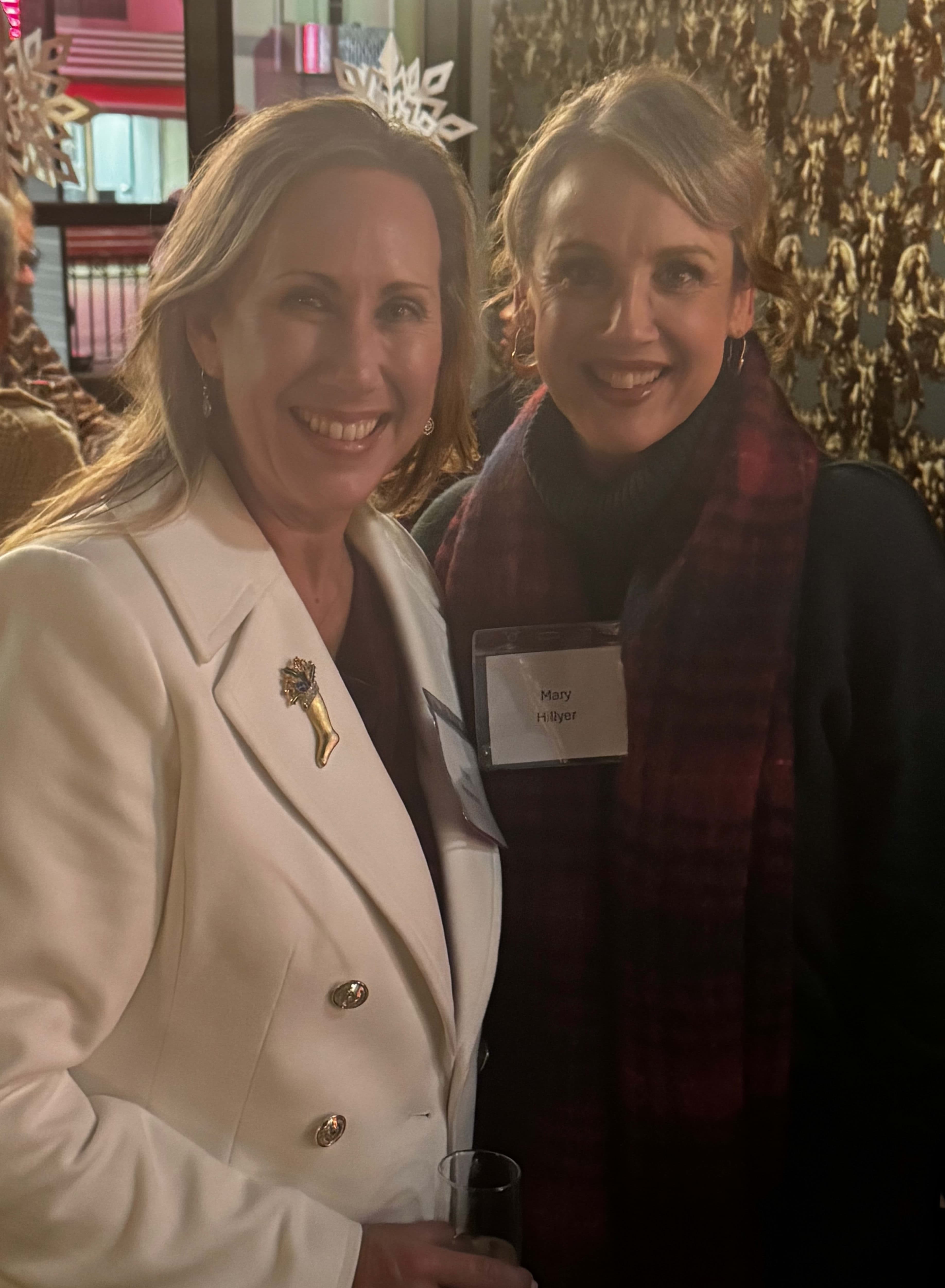 A couple of women standing next to each other