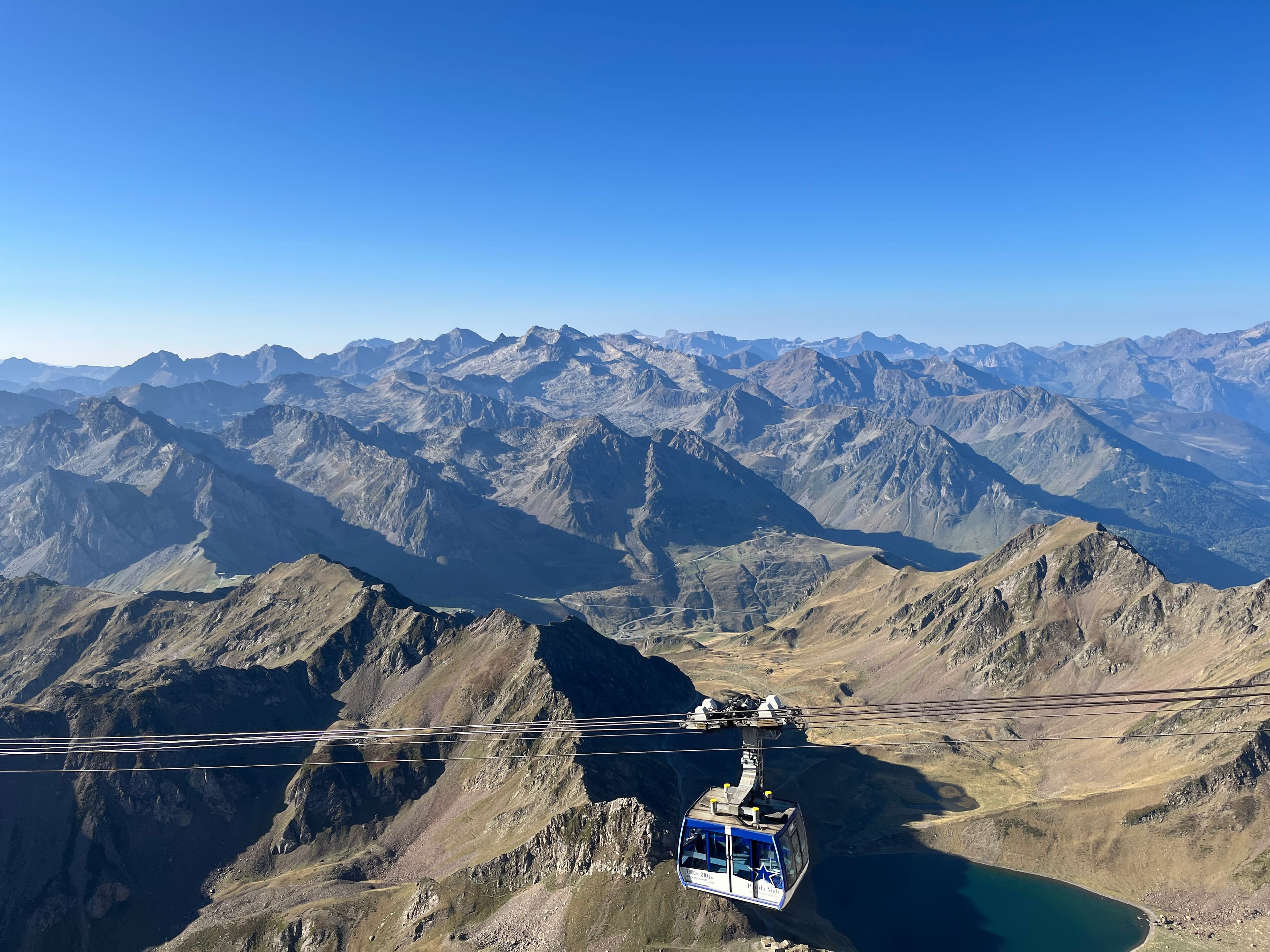 A cable car going over a mountain range